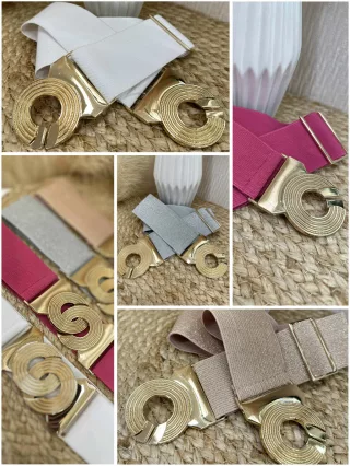 Curea elastică, groasă, cu cataramă metalică.